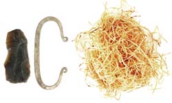 Fire striker, flint shard, and 1/2 oz. bag of tinder Fire striker, flint shard, and 1/2 oz. bag of tinder